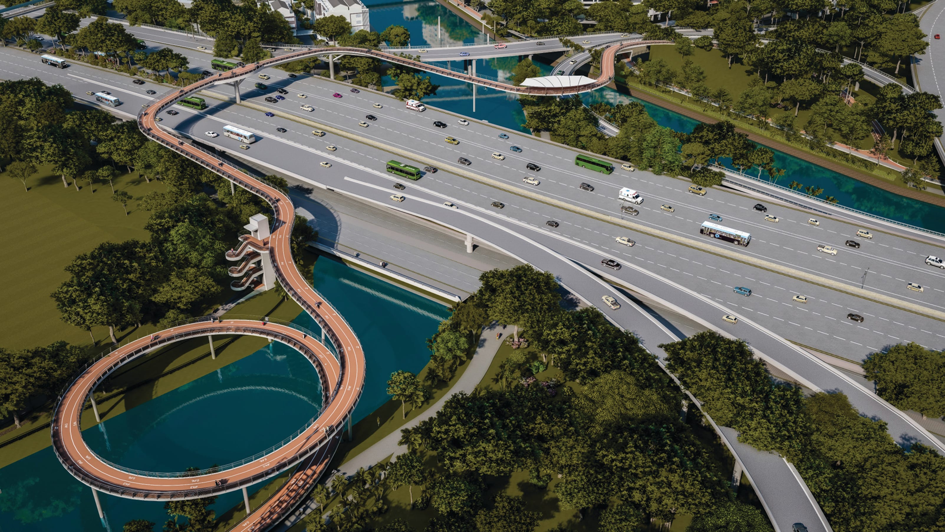 Aerial view of a multi-lane highway and pedestrian bridges over water, surrounded by green trees.